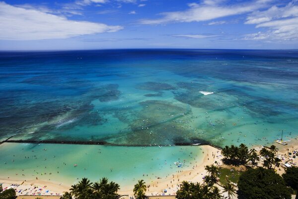 Sandy beach and emerald ocean