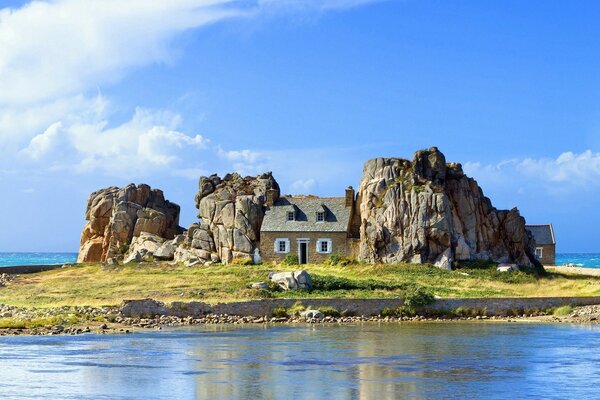 A house among the rocks on a small island