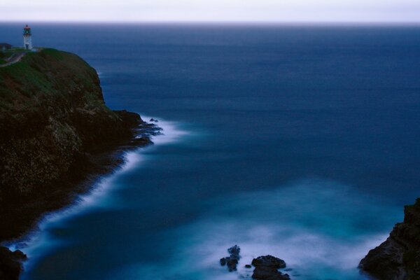 Beautiful sea in the rocks with a lighthouse