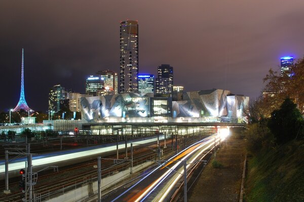 Tempting lights of the night city on the highway background