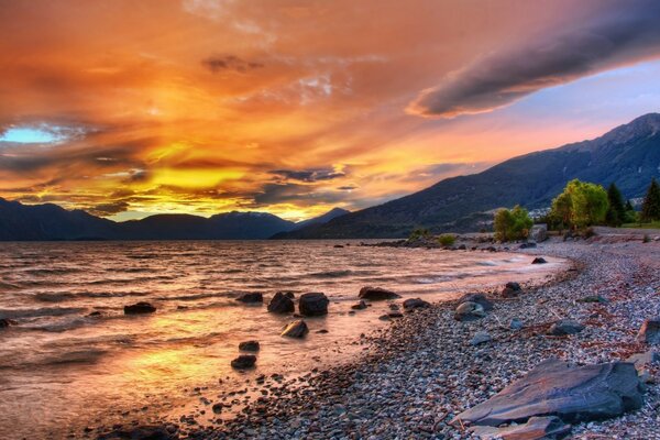 A bright palette of sunset colors by the lake