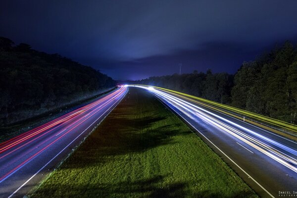 Photo of the night highway on the background of the night sky