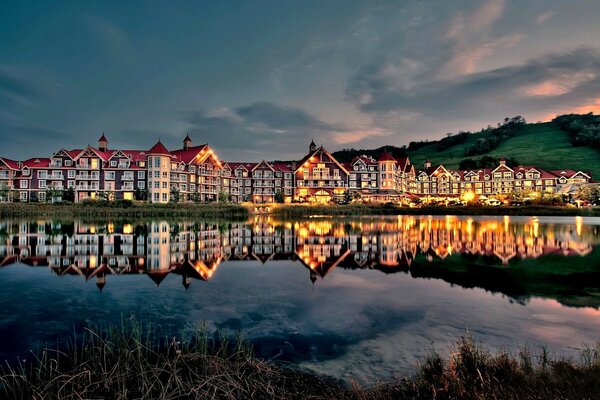 Tall houses near the water in the evening