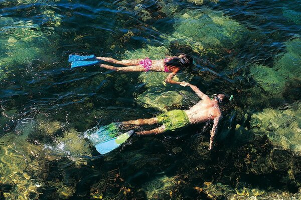 Exploring the underwater world by a girl and a guy