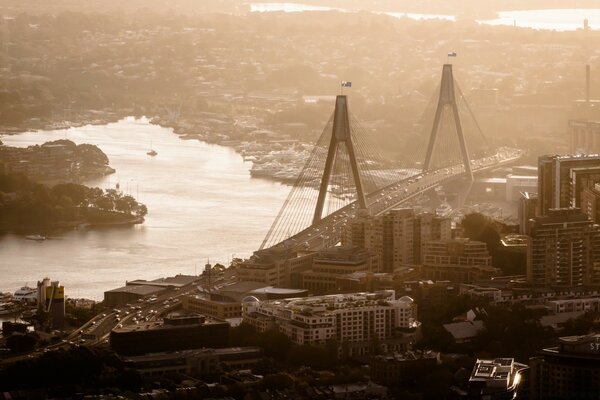 A gray city and a huge bridge across the river